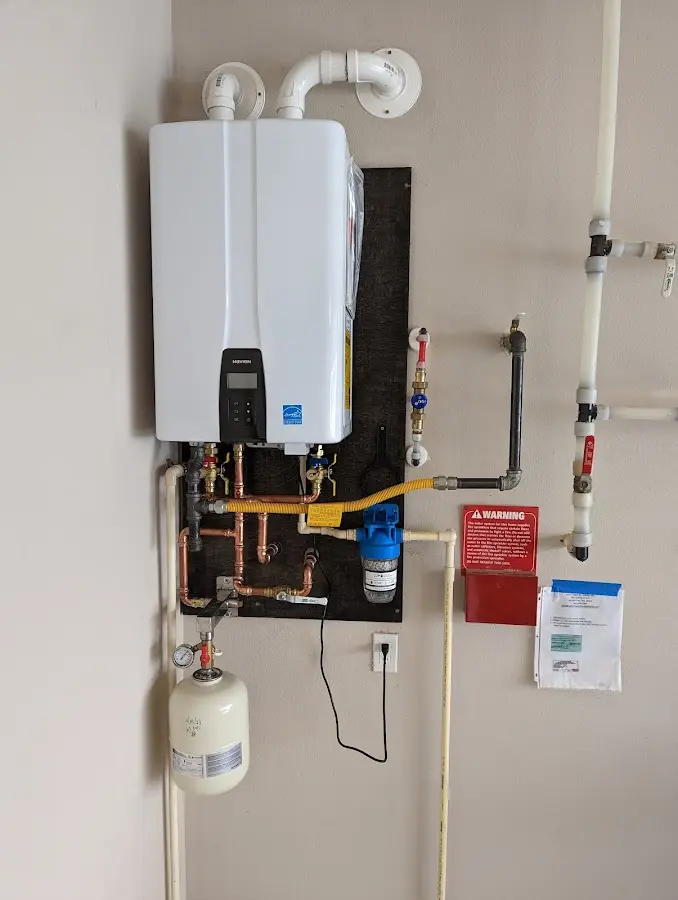 Professional plumber installing copper piping in a Cotulla home