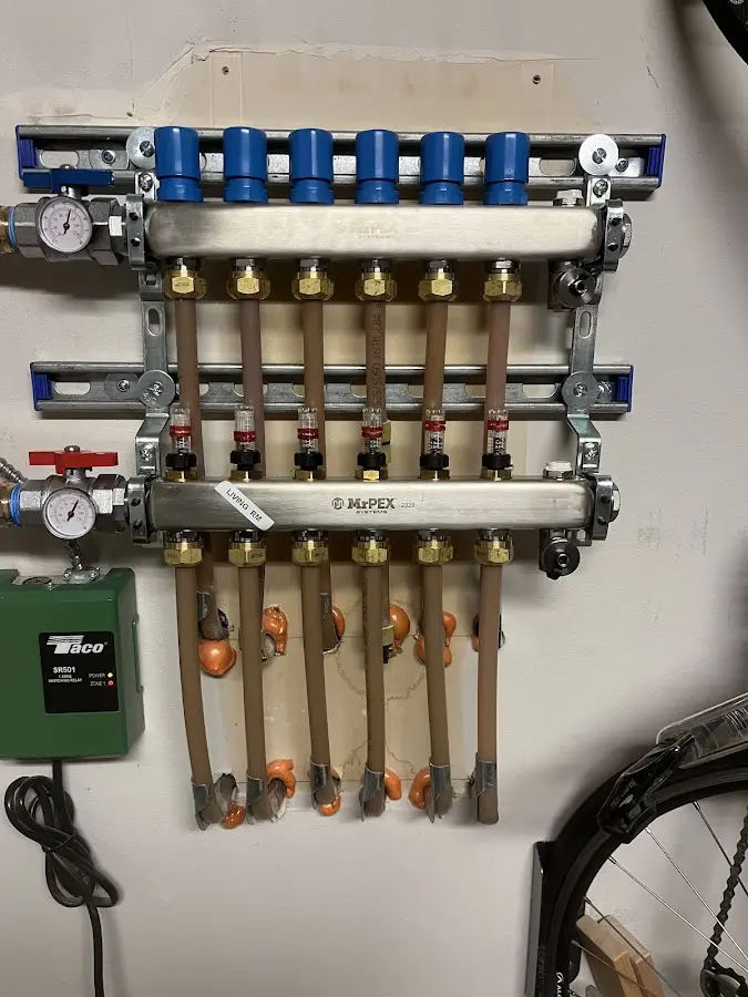 Plumber performing Water Heater Repair at a residential property in Cotulla